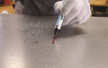 U-Mark WASHOFF marker washing off metal in a water bath with no halo or ghost